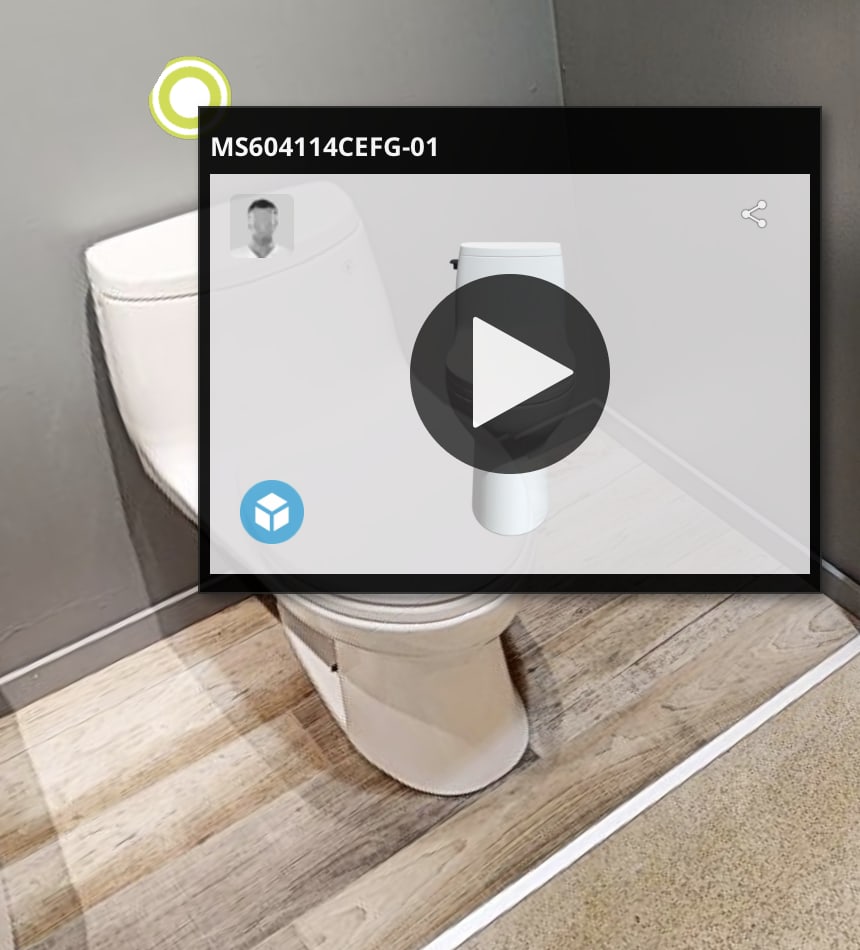 A media tag — a small video frame with a play overlay and the product SKU label, anchored to the fixture by a green target dot, sized to sit in the corner of the tour without taking over the view