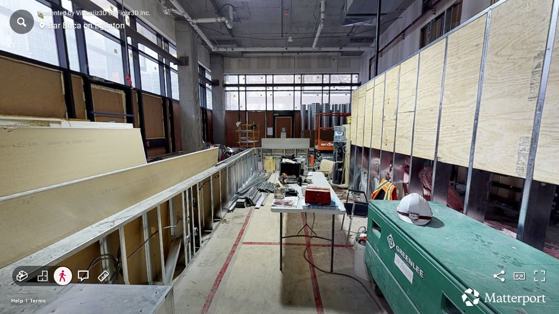 Bar Buca bar area in the first progress scan — bar layout staked, framing exposed